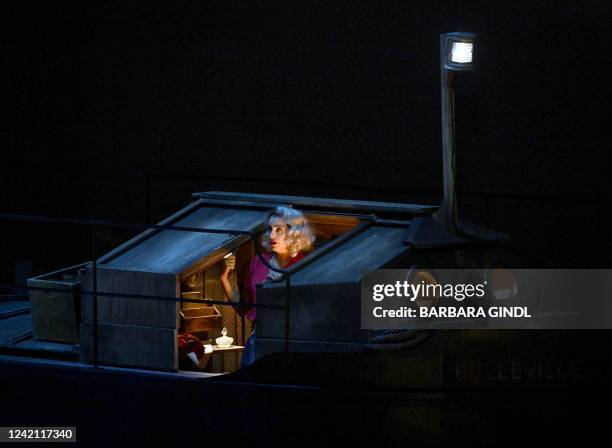 Lithuanian soprano Asmik Grigorian performs on stage during a dress rehearsal for the one-act opera 'Il tabarro', that is part of the opera trilogy...