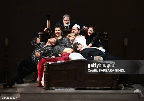 Georgian Baritone Misha Kiria and other members of the cast perform on stage during a dress rehearsal for the one-act opera 'Gianni Schicchi', that...