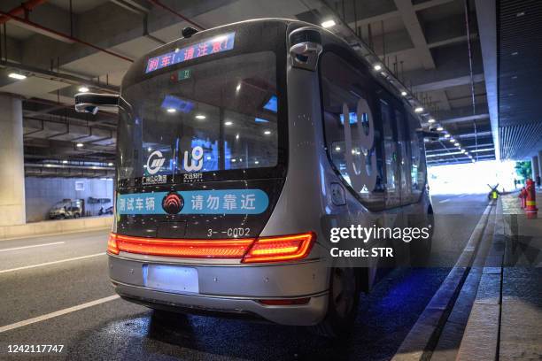 Self-driving minibus is seen during its trial operation in Guangzhou in China's southern Guangdong province on July 26, 2022. / China OUT