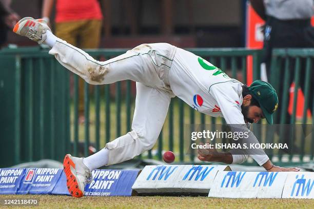 Pakistan's Fawad Alam fields a ball during the third day of plays of the second cricket Test match between Sri Lanka and Pakistan at the Galle...