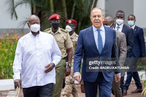 Ugandan President Yoweri Museveni walks with Russian Foreign Minister Sergei Lavrov at the State House in Entebbe, Uganda, on July 26, 2022.