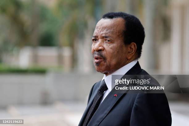 Cameroon's President Paul Biya waits for the arrival of France's President Emmanuel Macron for talks at the Presidential Palace in Yaounde, on July...