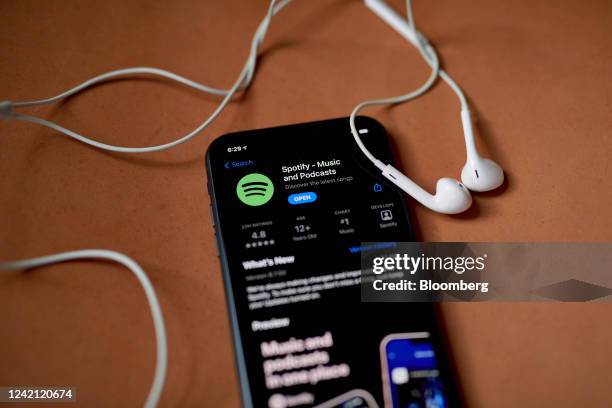 The Spotify application for download in the Apple App Store on a smartphone arranged in the Brooklyn borough of New York, US, on Friday, July 22,...