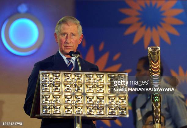 Britain's Prince Charles, Prince of Wales prepares to give a speech after placing the Queen's Baton in its holder during the XIX Commonwealth Games...