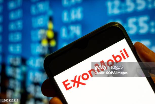 In this photo illustration, the American multinational oil and gas corporation Exxon Mobil logo is displayed on a smartphone screen.