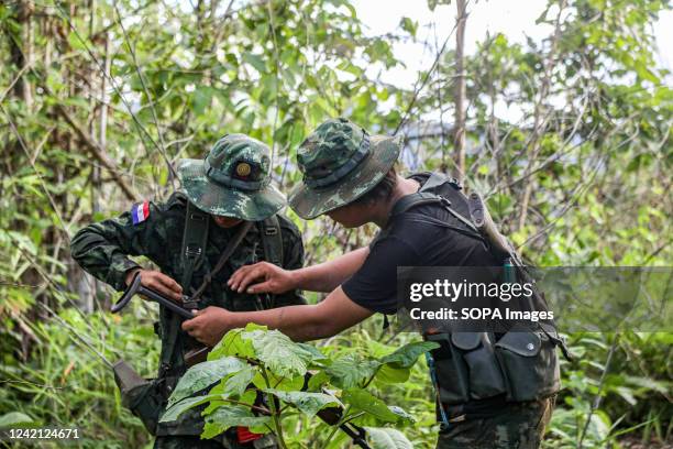 Kndf A Karenni Nationalities Defence Force soldier helps his co-soldier ...