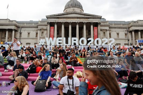 Supporters arrive on the fan zone in Trafalgar Square in front of the National Gallery in London, to attend the UEFA Women's Euro 2022 semi-final...