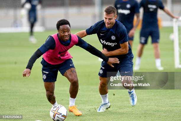 Raheem Sterling and César Azpilicueta of Chelsea during a training session at Chelsea Training Ground on July 26, 2022 in Cobham, England.