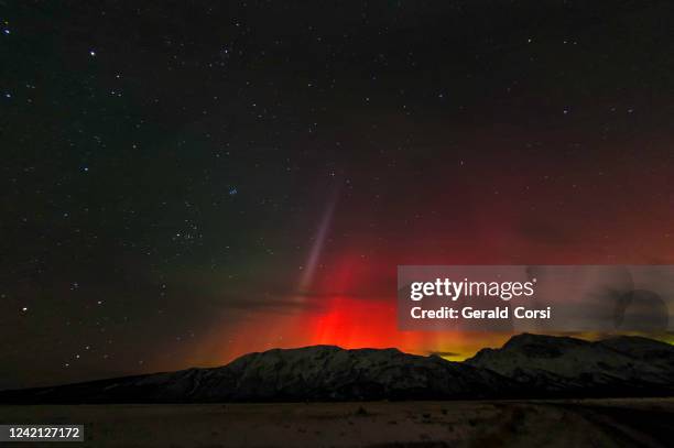 the aurora borealis is a natural light display in the sky particularly in the high latitude of the arctic regions, caused by the collision of energetic charged particles with atoms in the high altitude atmosphere (thermosphere). major solar flare causing - aurora stock pictures, royalty-free photos & images