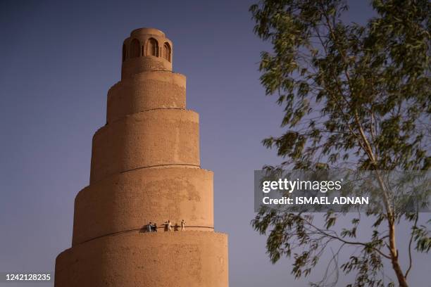 The spiral Malwiya minaret, a mid-ninth century treasured Iraqi national monument, stands at the site of the Great Mosque of Samarra, on July 26 in...