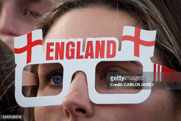 An England's supporter watches from the fan zone in Trafalgar Square, in London, the UEFA Women's Euro 2022 semi-final football match between England...