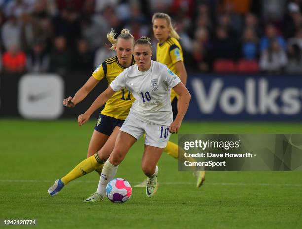 England's Georgia Stanway shields the ball from Sweden's Stina Blackstenius during the UEFA Women's Euro England 2022 Semi Final match between...