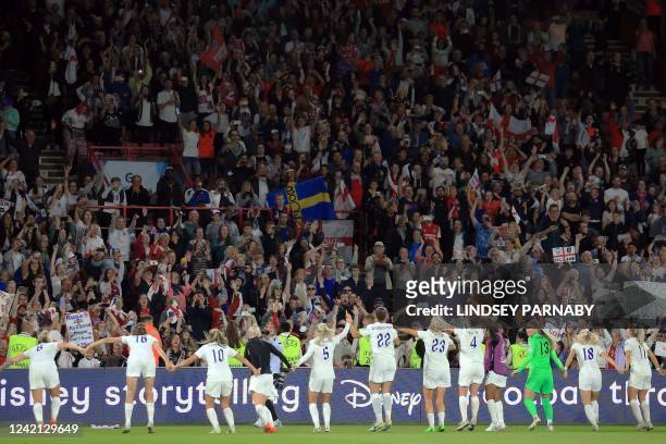 England's teammates celebrate with fans after winning at the end of the UEFA Women's Euro 2022 semi-final football match between England and Sweden...