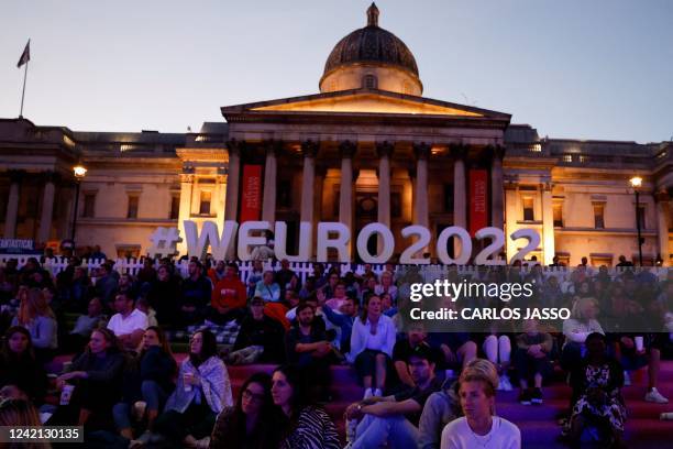 Supporters gather on the fan zone, in Trafalgar Square, in front of the National Gallery, in London, to attend the UEFA Women's Euro 2022 semi-final...