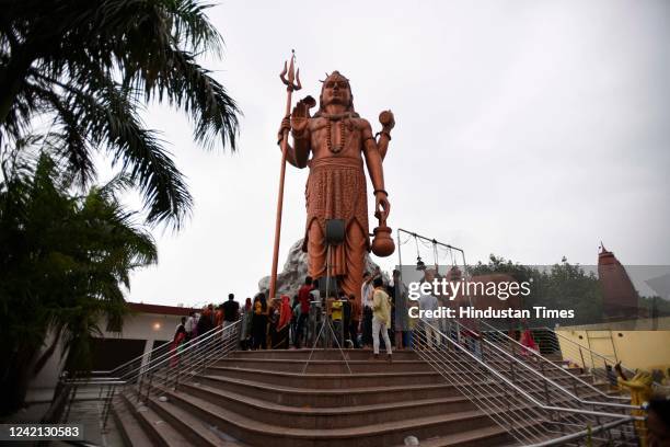 Hindu devotees offer prayers at the Shri Shri 1008 Baba Ratan Dass temple on the occasion of Shivratri festival, at Kadipur Village, near DHBVN...