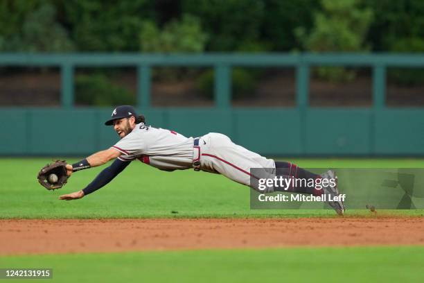 Dansby Swanson of the Atlanta Braves makes a diving stop on a ball hit by Bryson Stott of the Philadelphia Phillies in the bottom of the second...