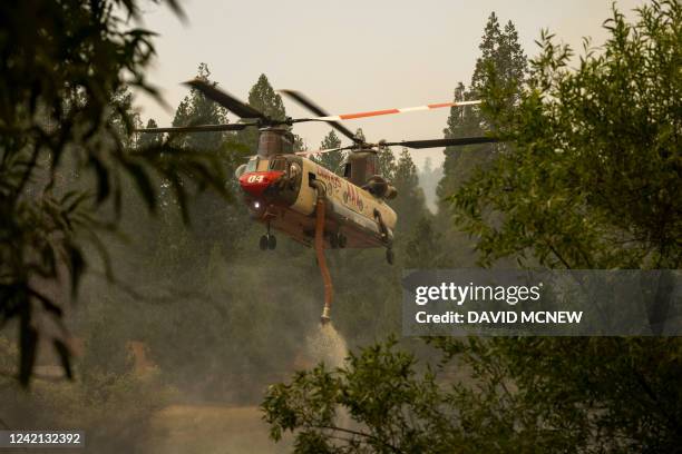 Billings 4AJ helicopter refills with water to drop at the Oak Fire near Mariposa, California, on July 26, 2022. Firefighters made progress battling...