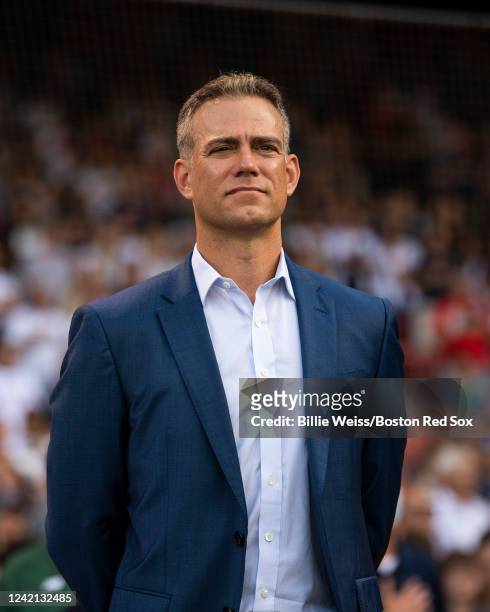 Major League Baseball executive Theo Epstein looks on during a pre-game ceremony in recognition of the National Baseball Hall of Fame induction of...