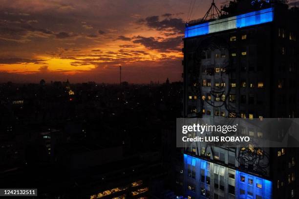 Argentina's Social Development Minister building, depicting an image of former First Lady Eva Peron, is illuminated after sunset on the 70th...