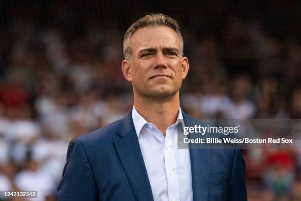 Major League Baseball executive Theo Epstein looks on during a pre-game ceremony in recognition of the National Baseball Hall of Fame induction of...