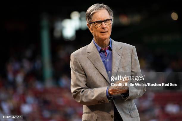 Boston Red Sox Principal Owner John Henry looks on during a pre-game ceremony in recognition of the National Baseball Hall of Fame induction of...