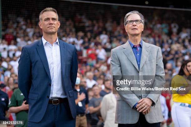 Major League Baseball executive Theo Epstein and Boston Red Sox principal owner John Henry look on during a pre-game ceremony in recognition of the...