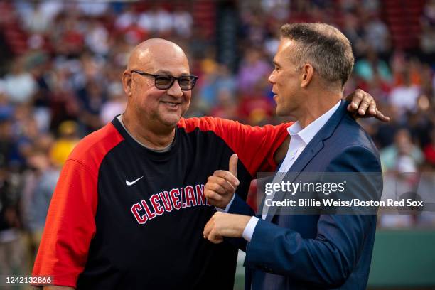 Cleveland Guardians manager Terry Francona speaks with Major League Baseball Executive Theo Epstein during a pre-game ceremony in recognition of the...