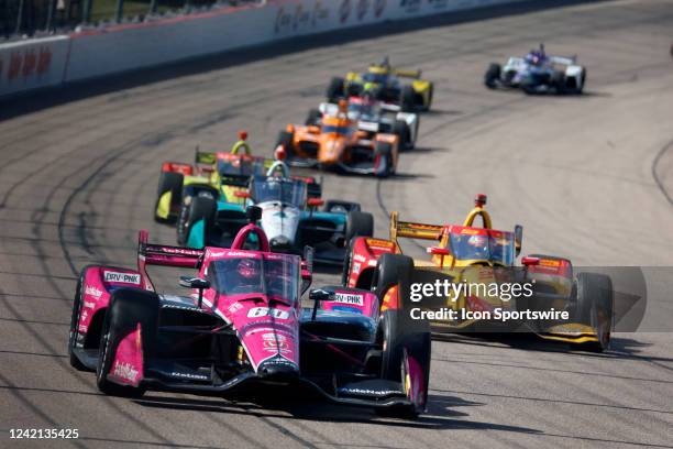 IndyCar series driver Simon Pagenaud leads a pack of cars coming out of turn 4 towards the start finish line during the Hy-Vee Salute To Farmers 300...