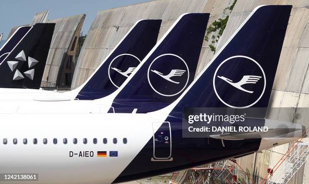 Several aircraft of German airline Lufthansa with the carrier's logo and the logo of global airline alliance Star Alliance are seen parked at the...