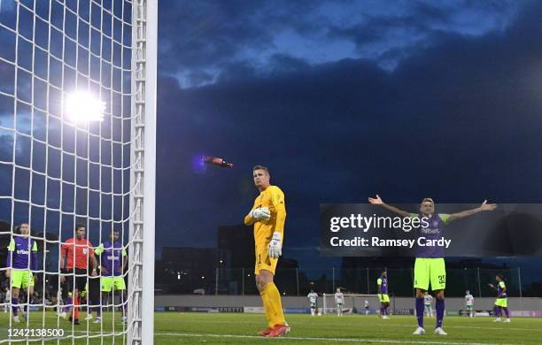 Tallaght , Ireland - 26 July 2022; Ludogorets goalkeeper Sergio Padt and Igor Plastun of Ludogorets react as bottles are thrown onto the pitch during...