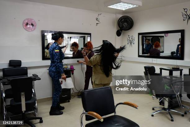 Jenny Achiardy is 33 years old and entered prison 10 years ago, works at the El Buen Pastor jail hairdresser in Bogota, Colombia on July 18, 2022....