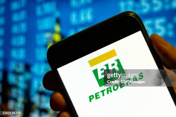 In this photo illustration, the Brazilian multinational oil and gas corporation Petróleo Brasileiro S.A., Petrobras, logo is displayed on a...