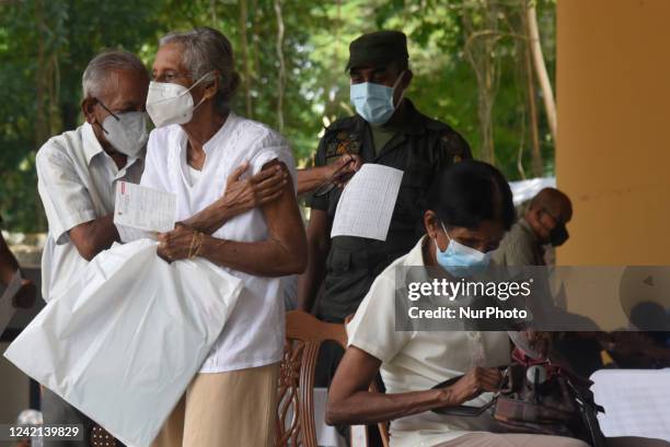 People getting COVID 19 booster vaccines near amid economic Crisis in Colombo Sri Lanka July 27, 2022