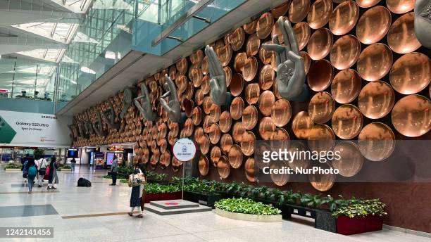 Mudras are displayed along a wall at Indira Gandhi International Airport in Delhi, India, on May 31, 2022.