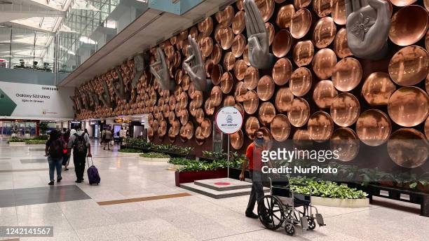 Mudras are displayed along a wall at Indira Gandhi International Airport in Delhi, India, on May 31, 2022.