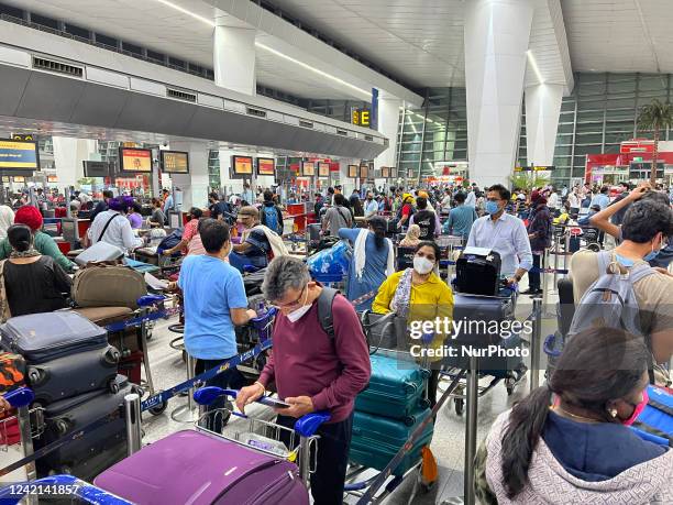 Crowd of travellers wait to check-in for their flight at Indira Gandhi International Airport in Delhi, India, on May 31, 2022.