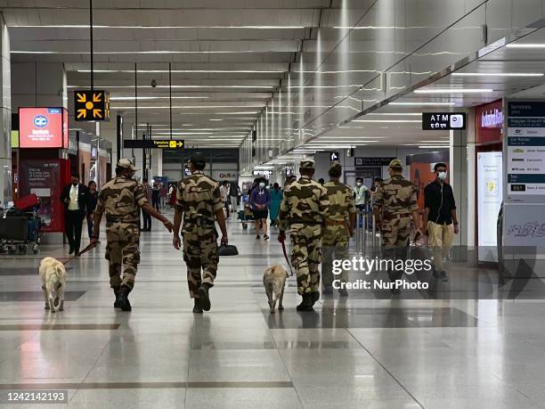 Soldiers from the Indian Army patrol with bomb sniffing dogs at Indira Gandhi International Airport in Delhi, India, on May 31, 2022.