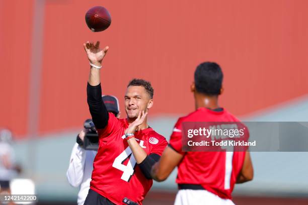 Desmond Ridder of Atlanta Falcons throws to Marcus Mariota during a training camp practice on July 27, 2022 in Flowery Branch, Georgia.