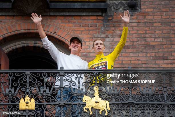 Jumbo-Visma team's Danish rider Jonas Vingegaard , winner of the 2022 Tour de France, waves with Danish cyclist Mads Pedersen to a huge crowd from...