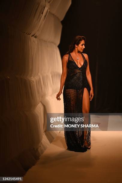 Bollywood actress Malaika Arora presents a creation by designers Rohit Gandhi + Rahul Khanna during the FDCI India Couture Week in New Delhi on July...