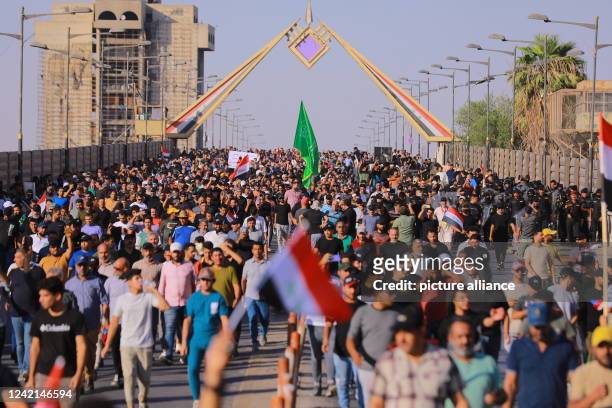 July 2022, Iraq, Baghdad: Protesters take part in a demonstration by supporters of Iraq's influential Shiite cleric Moqtada al-Sadr outside the...