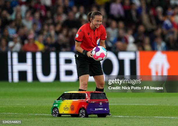 The Tiny Football Car delivers the match ball to referee Cheryl Foster before the UEFA Women's Euro 2022 semi-final match at Stadium MK, Milton...