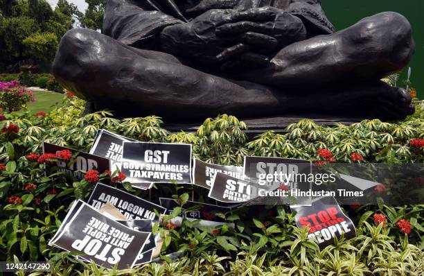 Placards seen at the Parliament House premises during a protest by the suspended MPs over price hike of fuel and LPG cylinders, and increase in GST...