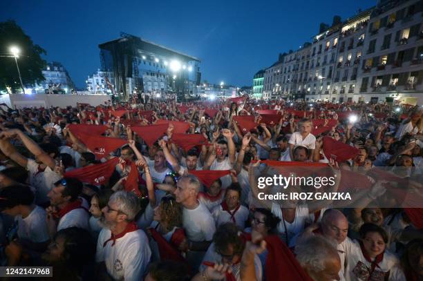 Crowds of revellers gather in front of the town hall, during the opening ceremony of The Fetes de Bayonne, in Bayonne, southwestern France on July...