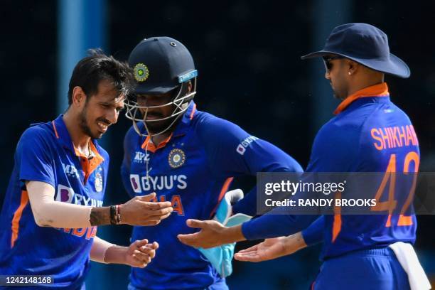 Yuzvendra Chahal , Sanju Samson , and Shikhar Dhawan , of India, celebrate the dismissal of Shai Hope, of West Indies, during the third and final ODI...