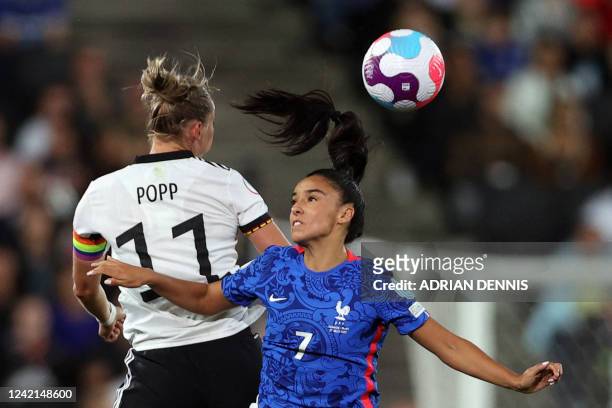 Germany's striker Alexandra Popp vies with France's defender Sakina Karchaoui during the UEFA Women's Euro 2022 semi-final football match between...