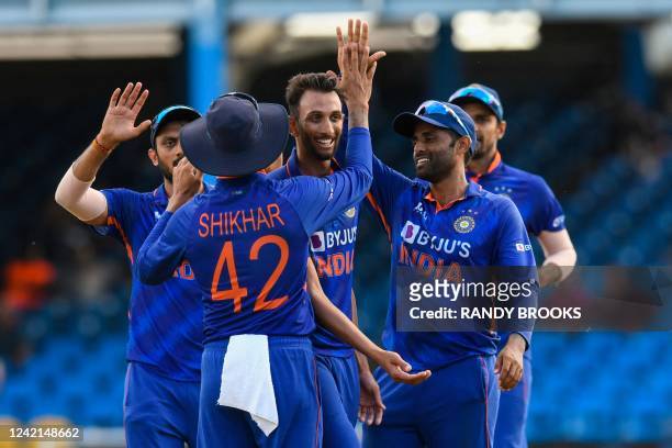 Prasidh Krishna and Suryakumar Yadav , of India, celebrate the dismissal of Nicholas Pooran, of West Indies, during the third and final ODI match...