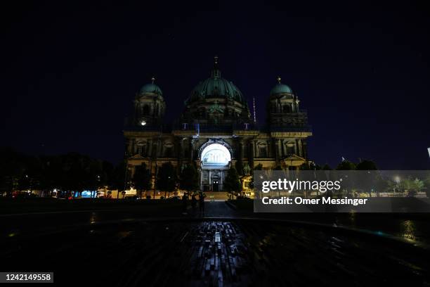 View of the darkened Berlin Cathedral with its facade illumination turned off on July 27, 2022 in Berlin, Germany. Berlin's Senate Department for the...