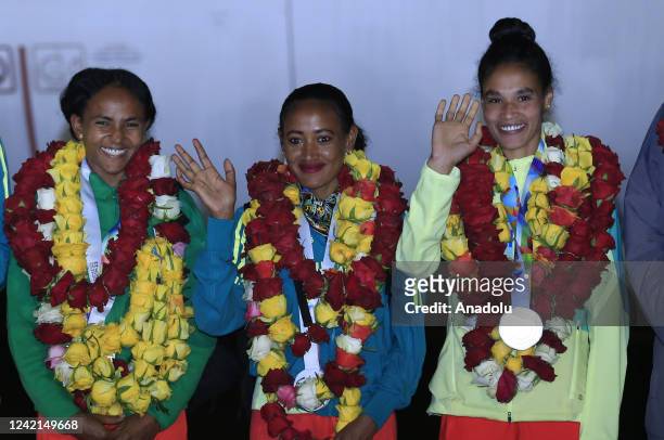 Ethiopian athletes are seen during a welcoming ceremony for athletes returning with 4 gold, 4 silver and 2 bronze medals at the 18th World Athletics...