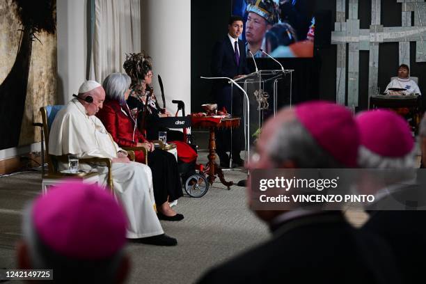 Pope Francis and Governor General of Canada Mary Simon listen as Canadian Prime Minister Justin Trudeau speaks during a meeting with civil...